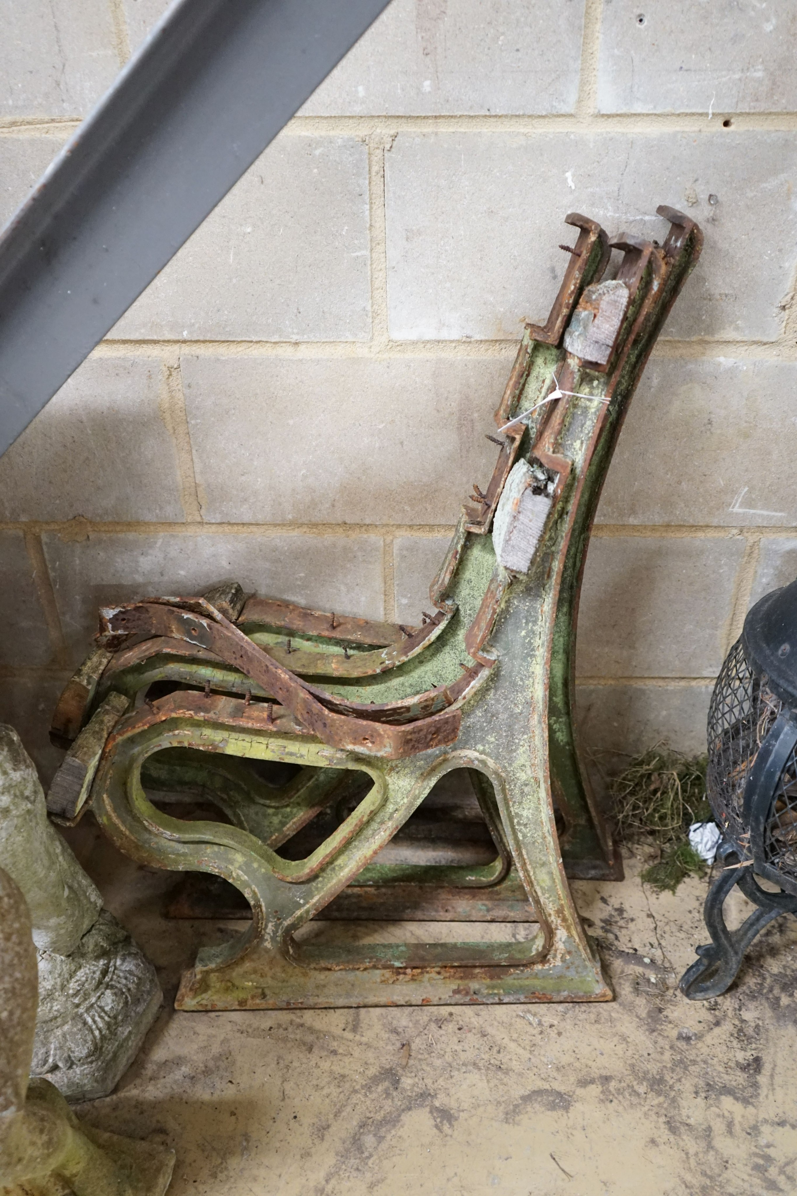 An early 20th century cast iron three section bench frame, probably marine or municipal, height 85cm